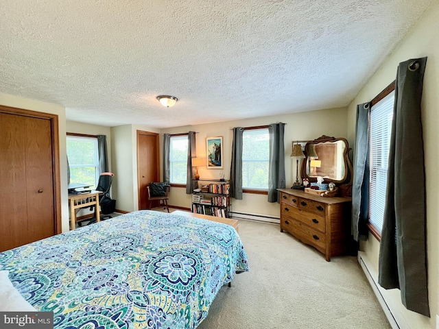 299 Valentine Acres Rd, Clearville, PA 15535 - bedroom with multiple windows, light carpet, a textured ceiling, a baseboard radiator, and two closets
