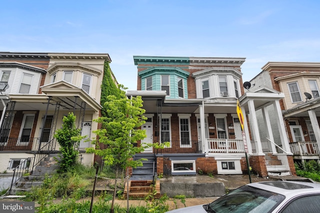 1619 Moreland Ave, Baltimore, MD 21216 - townhome / multi-family property with covered porch and stairs