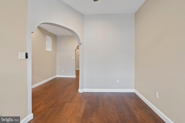 1619 Moreland Ave, Baltimore, MD 21216 - spare room with arched walkways, wood finished floors, baseboards, and ceiling fan
