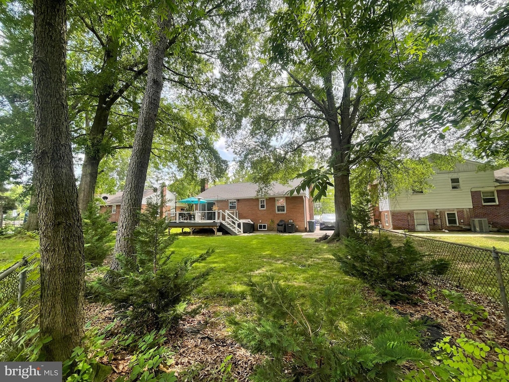 4440 Wells Pkwy, Hyattsville, MD 20782 - view of yard with a deck, stairway, and central air condition unit