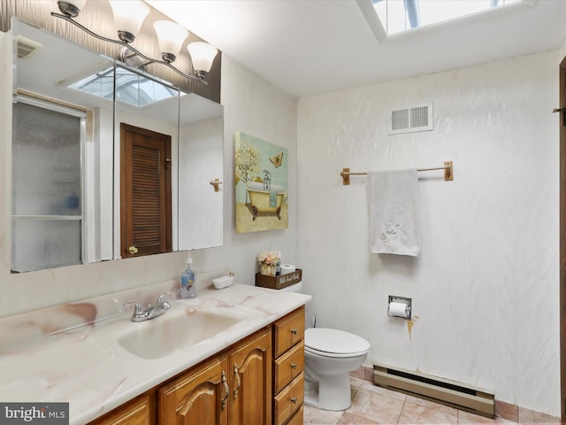 11815 Oriole Dr, Hagerstown, MD 21742 - bathroom featuring baseboard heating, vanity, toilet, and a skylight