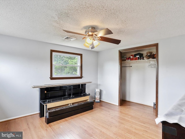 11815 Oriole Dr, Hagerstown, MD 21742 - bedroom with wood finished floors, a closet, a textured ceiling, ceiling fan, and baseboards