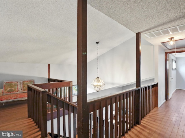 11815 Oriole Dr, Hagerstown, MD 21742 - hallway with a textured ceiling, wood finished floors, an upstairs landing, and attic access