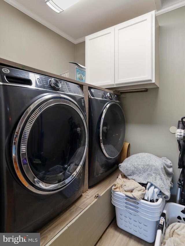 11815 Oriole Dr, Hagerstown, MD 21742 - washroom with cabinet space, washer and clothes dryer, and crown molding