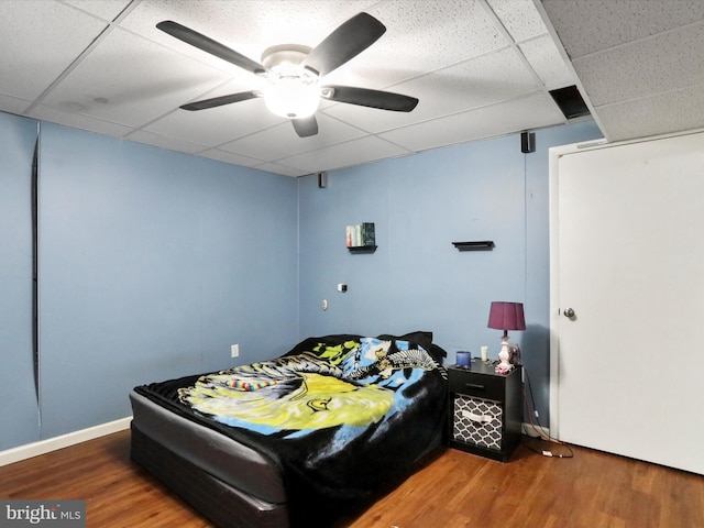 11815 Oriole Dr, Hagerstown, MD 21742 - bedroom featuring a drop ceiling, wood finished floors, baseboards, and a ceiling fan