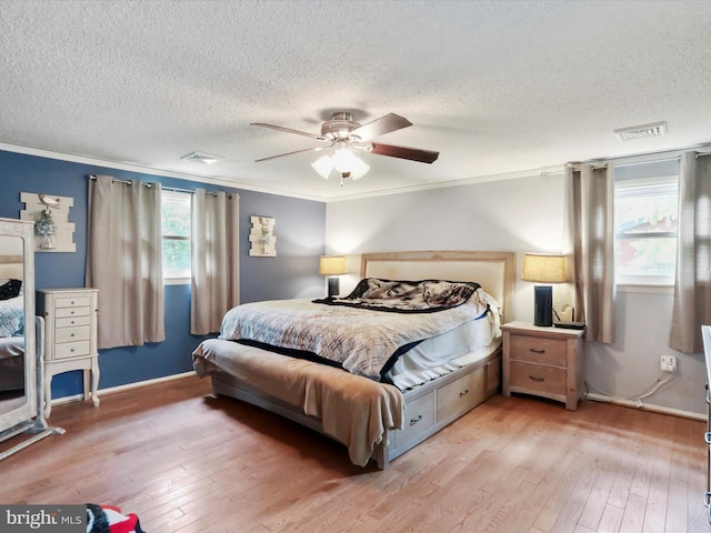 11815 Oriole Dr, Hagerstown, MD 21742 - bedroom with a textured ceiling, crown molding, wood-type flooring, ceiling fan, and baseboards