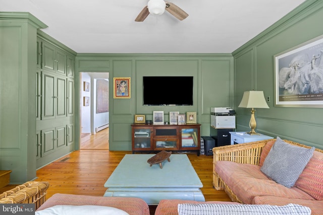 65 Covered Bridge Rd, New Hope, PA 18938 - living room with a decorative wall, light wood-type flooring, a ceiling fan, and a baseboard heating unit