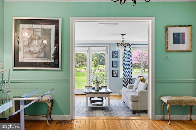 65 Covered Bridge Rd, New Hope, PA 18938 - sitting room featuring a chandelier, wood-type flooring, and baseboards
