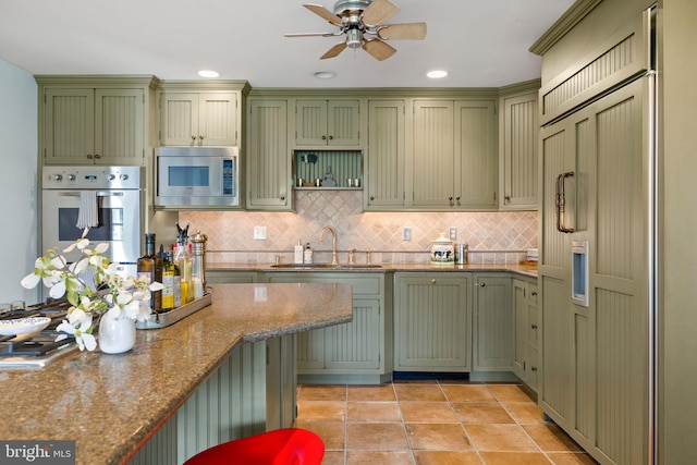 65 Covered Bridge Rd, New Hope, PA 18938 - kitchen featuring green cabinetry, built in appliances, a sink, and recessed lighting