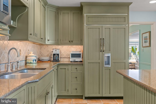 65 Covered Bridge Rd, New Hope, PA 18938 - kitchen featuring green cabinetry, a sink, paneled refrigerator, and decorative backsplash