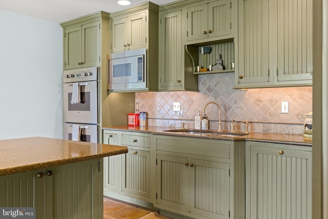 65 Covered Bridge Rd, New Hope, PA 18938 - kitchen featuring green cabinets, a sink, stainless steel microwave, and double oven