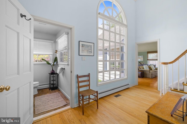 65 Covered Bridge Rd, New Hope, PA 18938 - foyer entrance with plenty of natural light, stairs, light wood finished floors, a towering ceiling, and baseboard heating