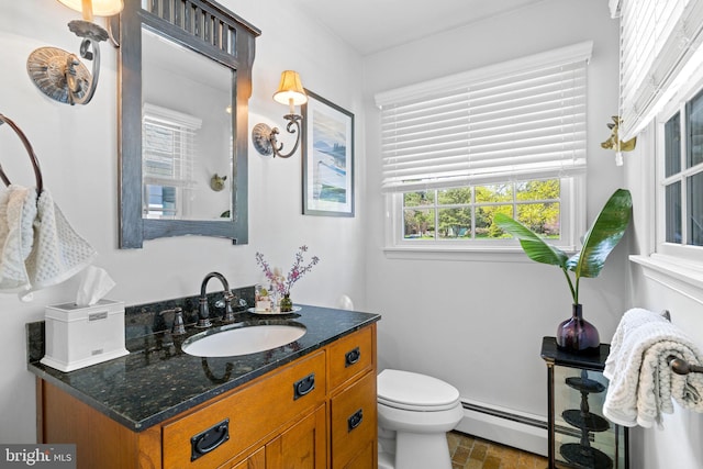 65 Covered Bridge Rd, New Hope, PA 18938 - bathroom featuring baseboard heating, vanity, and toilet
