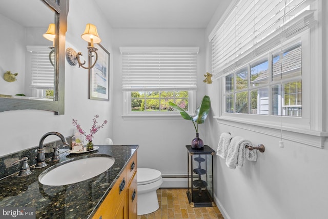 65 Covered Bridge Rd, New Hope, PA 18938 - bathroom with vanity, toilet, a baseboard heating unit, baseboards, and brick patterned floors