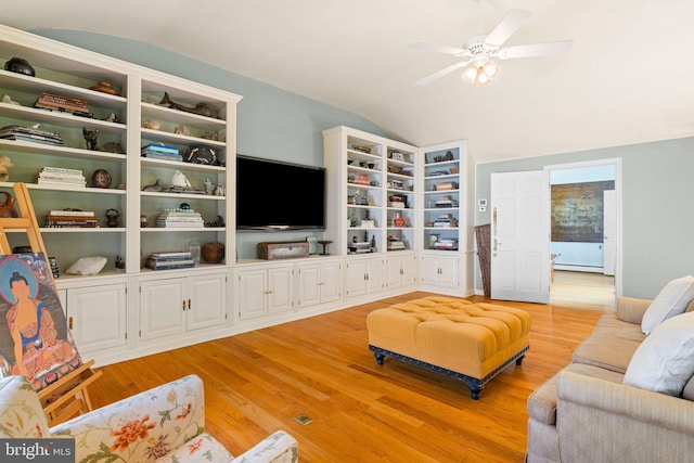 65 Covered Bridge Rd, New Hope, PA 18938 - living room featuring vaulted ceiling, light wood-style flooring, ceiling fan, and a baseboard radiator
