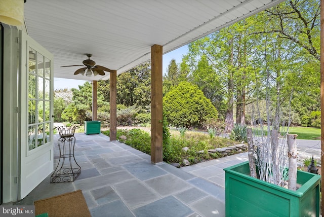 65 Covered Bridge Rd, New Hope, PA 18938 - view of patio featuring a ceiling fan and view of wooded area
