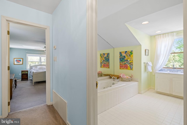 65 Covered Bridge Rd, New Hope, PA 18938 - bathroom with a jetted tub, a sink, ensuite bath, ceiling fan, and baseboards