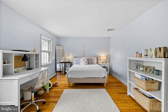 65 Covered Bridge Rd, New Hope, PA 18938 - bedroom with a desk, wood finished floors, a baseboard radiator, and baseboards