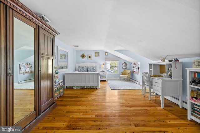 65 Covered Bridge Rd, New Hope, PA 18938 - bedroom with wood-type flooring, a baseboard radiator, vaulted ceiling, and baseboards