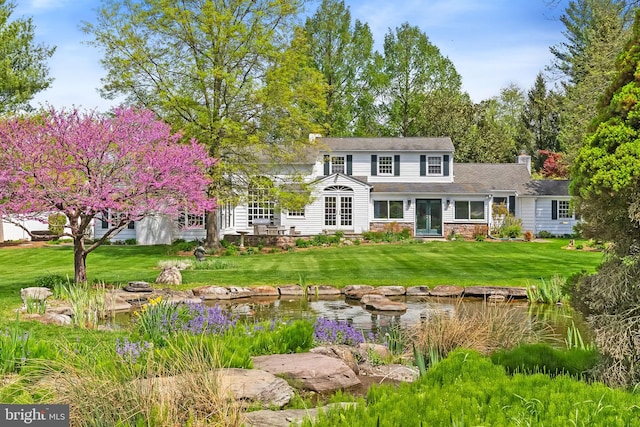 65 Covered Bridge Rd, New Hope, PA 18938 - view of front of home featuring a chimney and a front lawn