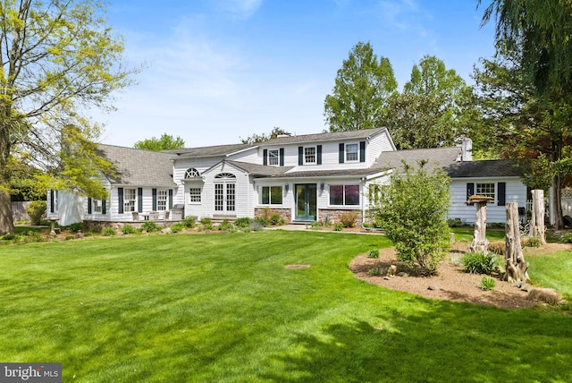 65 Covered Bridge Rd, New Hope, PA 18938 - view of front of home featuring french doors, a front lawn, and stone siding