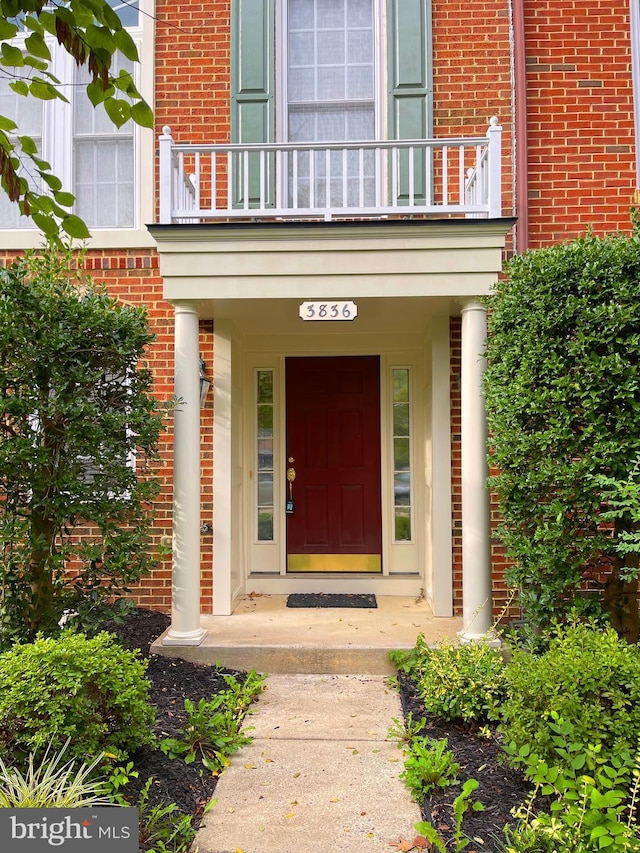 3836 Sugarloaf Pkwy, Frederick, MD 21704 - doorway to property featuring a balcony and brick siding