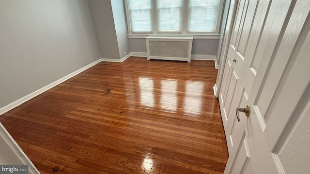 2126 E Sanger St, Philadelphia, PA 19124 - empty room with radiator and hardwood / wood-style floors
