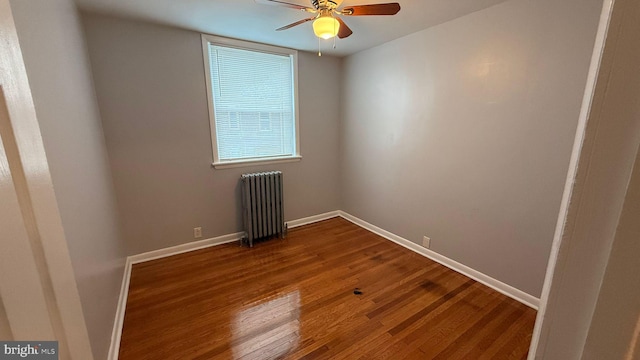 2126 E Sanger St, Philadelphia, PA 19124 - unfurnished room with radiator, dark wood-type flooring, and a ceiling fan