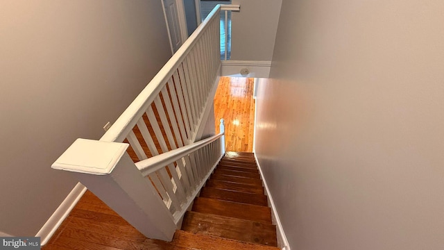 2126 E Sanger St, Philadelphia, PA 19124 - stairs featuring wood finished floors and baseboards