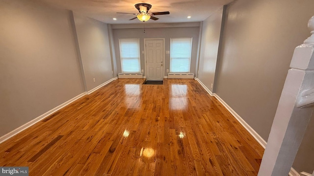 2126 E Sanger St, Philadelphia, PA 19124 - empty room with baseboard heating, a ceiling fan, wood finished floors, and recessed lighting