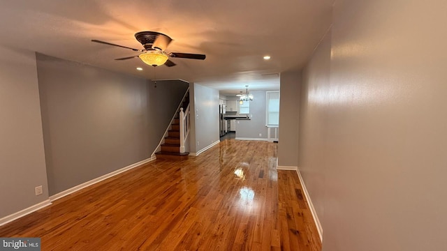 2126 E Sanger St, Philadelphia, PA 19124 - corridor featuring a chandelier, wood finished floors, stairway, and recessed lighting