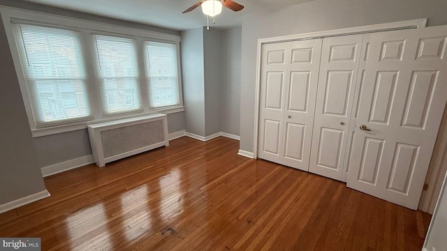 2126 E Sanger St, Philadelphia, PA 19124 - unfurnished bedroom with radiator, a closet, wood finished floors, and a ceiling fan
