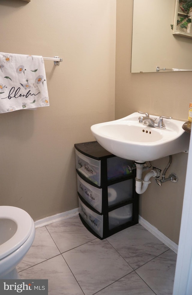 9 Wyndham Ct, Downingtown, PA 19335 - half bath featuring marble finish floors, a sink, toilet, and baseboards