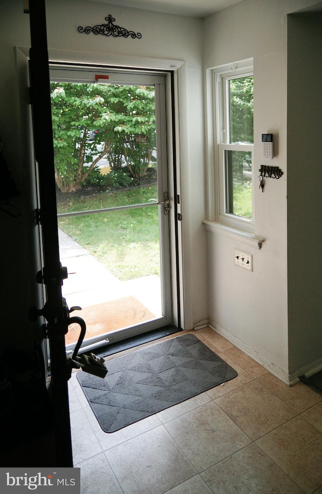 9 Wyndham Ct, Downingtown, PA 19335 - doorway to outside with baseboards and tile patterned floors