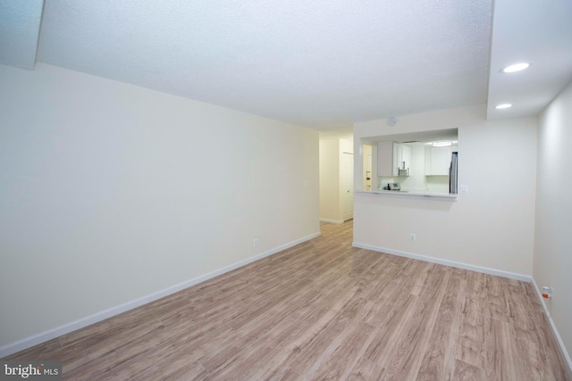 2030 N Adams St Unit 509, Arlington, VA 22201 - unfurnished room with light wood-style floors, baseboards, and recessed lighting