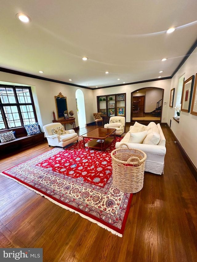 1319 Remington Rd, Wynnewood, PA 19096 - living area featuring arched walkways, wood finished floors, ornamental molding, baseboards, and recessed lighting