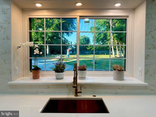 1319 Remington Rd, Wynnewood, PA 19096 - kitchen view of a sink, light countertops, and recessed lighting