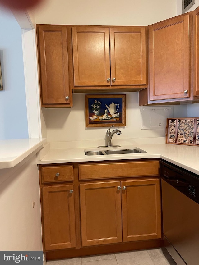 510 N Street Street SW Unit N223, Washington, DC 20024 - kitchen with stainless steel dishwasher, a sink, light countertops, and brown cabinetry
