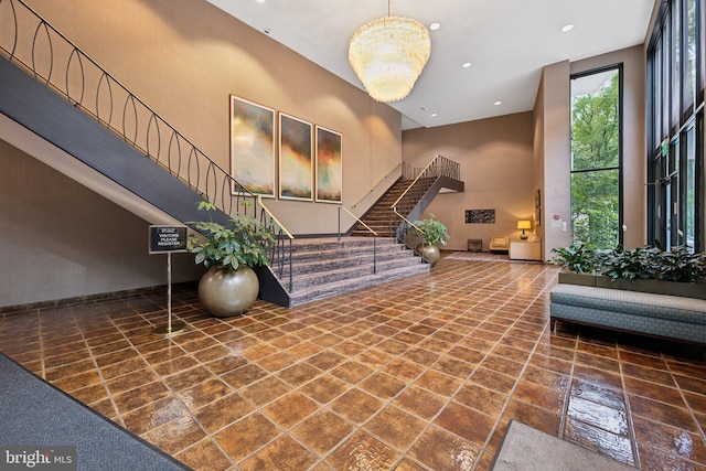 9039 Sligo Creek Pkwy Unit 916, Silver Spring, MD 20901 - building lobby featuring a high ceiling, stairway, and recessed lighting