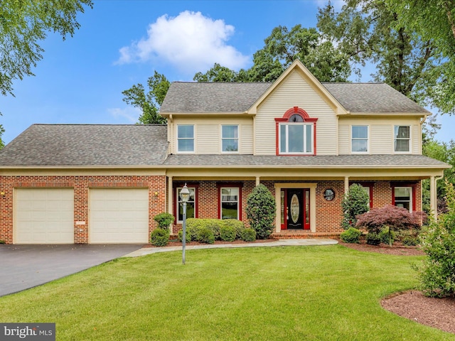 13901 Sullivan Ct, Silver Spring, MD 20906 - view of front of property featuring a garage, asphalt driveway, a front lawn, brick siding, and roof with shingles