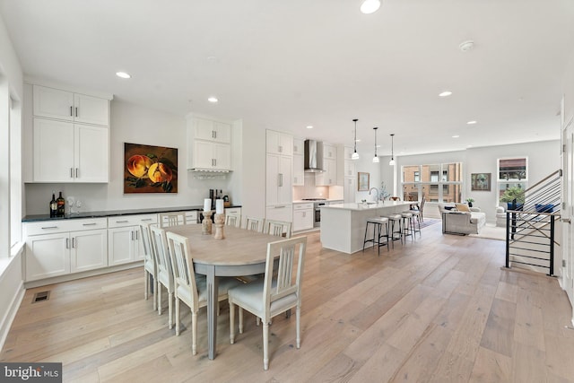 3546 Sutton Heights Cir, Fairfax, VA 22031 - dining space featuring recessed lighting, light wood-style floors, and stairway