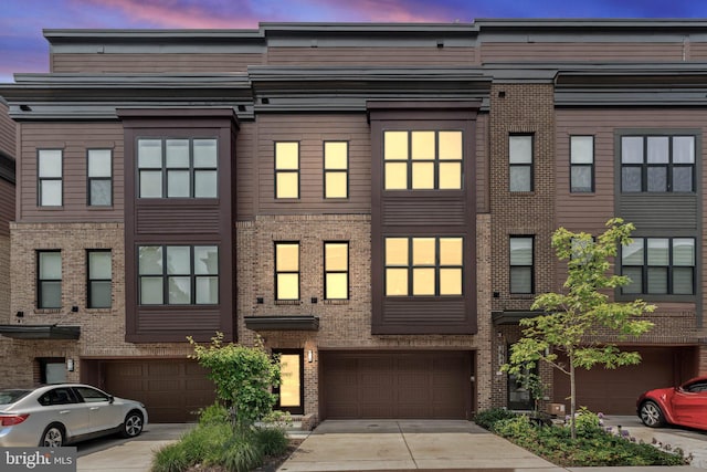 3546 Sutton Heights Cir, Fairfax, VA 22031 - view of property featuring an attached garage, brick siding, and driveway