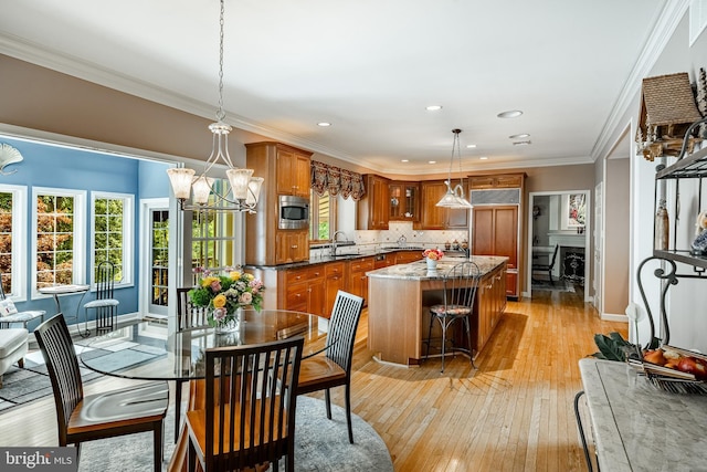 1217 Tullamore Cir, Chester Springs, PA 19425 - dining space featuring a chandelier, light wood-style floors, recessed lighting, and ornamental molding