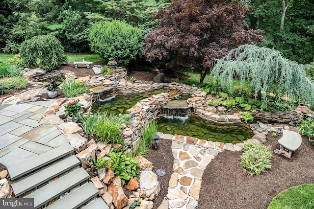 1217 Tullamore Cir, Chester Springs, PA 19425 - view of yard featuring a garden pond