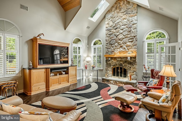 1217 Tullamore Cir, Chester Springs, PA 19425 - living area featuring high vaulted ceiling, a skylight, dark wood finished floors, and a fireplace