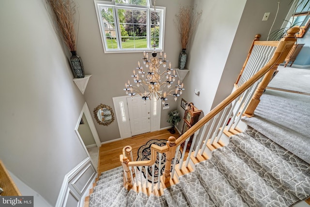 1217 Tullamore Cir, Chester Springs, PA 19425 - foyer with wood finished floors, a high ceiling, a chandelier, and stairway