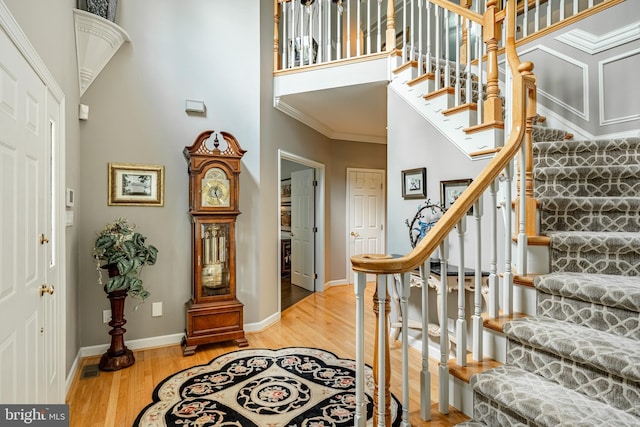1217 Tullamore Cir, Chester Springs, PA 19425 - foyer featuring stairway, a high ceiling, wood finished floors, and ornamental molding