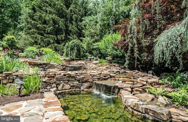 1217 Tullamore Cir, Chester Springs, PA 19425 - view of yard featuring a view of trees and a small pond