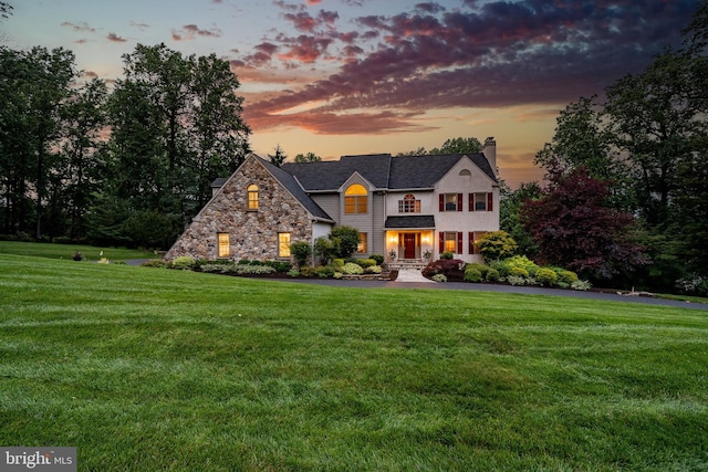 1217 Tullamore Cir, Chester Springs, PA 19425 - view of front of property featuring a chimney, a lawn, and stone siding