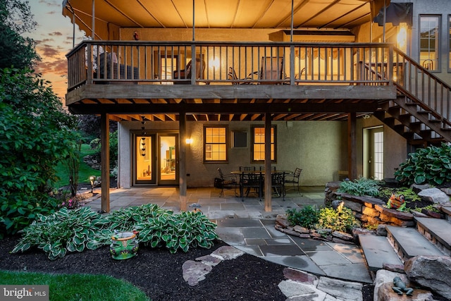 1217 Tullamore Cir, Chester Springs, PA 19425 - rear view of house featuring stucco siding, a patio, stairway, and a deck